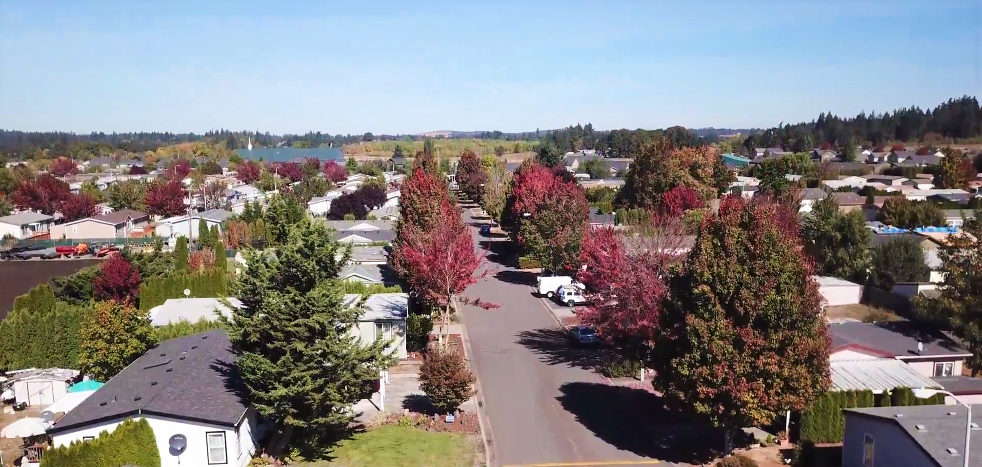 aerial photo of mobile homes with fall color trees